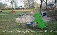 Sandkasten mit Dino