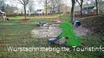 Sandkasten mit Dino